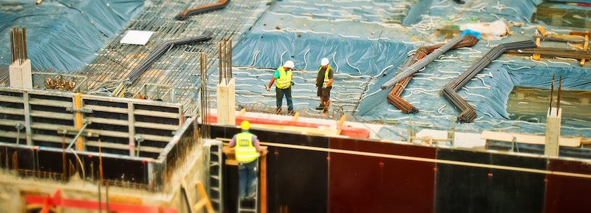 Top view of commercial construction and workers