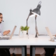 Four office staff on support calls with headsets