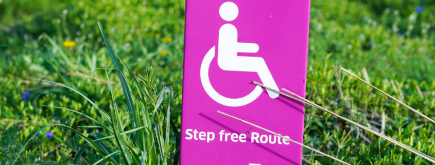 pink sign for step free route