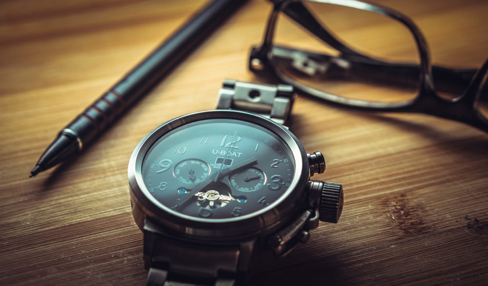 a watch sitting on a desk